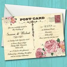 an old fashioned postcard wedding save the date card with pink flowers on cream paper