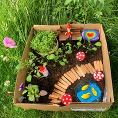 an open cardboard box filled with plants and toys