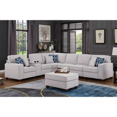 a living room scene with focus on the sectional sofa and footstool, along with an ottoman