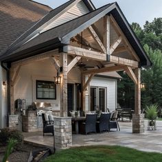 an outdoor kitchen and dining area is shown