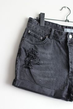 Denim shorts with handmade rips and holes. *High waisted fit *Graphite denim *Handmade holes and cuffed legs *One of a kind item *100% Cotton denim (do not stretch) Size: W30 (from tag) / Large Waist: 31,5 inches / 80 cm Hips: 42 inches / 107 cm Rise: 12,25 inches / 31,5 cm Inseam: 1,75 inches / 5 cm Take a look at other denim shorts from my shop: https://www.etsy.com/shop/sisudenimstore?section_id=21382979 Sisu Denim is a part of Sisu Vintage Store, which you can find here: sisuvintagestore.ets Gray Cutoff Jean Shorts For Summer, Trendy Ripped Washed Black Jean Shorts, Washed Black Ripped Cotton Shorts, Edgy Ripped Washed Black Jean Shorts, Edgy Washed Black Ripped Jean Shorts, Edgy Ripped Washed Black Shorts, Ripped Washed Black Jean Shorts, Distressed Washed Black Grunge Shorts, Distressed Grunge Washed Black Shorts