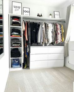 a white closet filled with lots of clothes