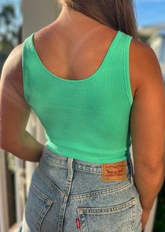 Introducing The Bryer Crop - the ultimate ribbed tank with a playful twist! With its button top design and cropped style, this top is perfect for adding a touch of fun to any outfit. Stay trendy and comfortable in The Bryer Crop! Trendy Green Scoop Neck Crop Top, Casual Ribbed Cotton Crop Top, Casual Ribbed Cropped Tank Top, Casual Solid Cropped Tank Top, Trendy Green Crop Top Tank, Casual Ribbed Cropped Crop Top, Casual Ribbed Crop Top Tank Top, Trendy Tank Crop Top For Day Out, Green Cropped Top For Everyday