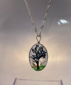 "A stunning recycled 925 sterling silver wave necklace 20\" long with handmade transparent resin pendant with delicate vinyl printed tree details and a dried flower to represent the leaves on the tree,  wrapped with sterling silver wire.  There are additional colour options for the leaves (the dried flower) blue, green, purple, red, white and yellow. Please select your chosen colour from the drop down option.  Each necklace comes in a black gift box. Every item I make is handmade with care and love and May differ slightly from the photo" Silver Nature-inspired Jewelry With Pressed Flowers, Nature-inspired Silver Jewelry With Pressed Flowers, Oval Clear Jewelry Gift, Oval Clear Jewelry For Gifts, Nature-inspired Clear Jewelry For Gifts, Nature-inspired Clear Jewelry Gift, Clear Nature-inspired Jewelry For Gift, Oval Silver Necklace With Pressed Flowers, Nature-inspired Silver Resin Jewelry