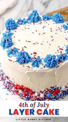 a fourth of july layer cake with red, white and blue sprinkles