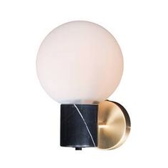 a wall light with a white glass ball on the front and black metal frame around it