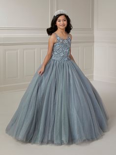 Your sweet girl will make a grand entrance in this bead embroidered long sleeveless illusion dress with A-line tulle skirt by Tiffany Princess 13723. This sleeveless gown features an illusion scoop neck sweetheart bodice with floral beaded embellishments, A-line sparkle tulle skirt, sweep train, and a lace-up back. House of Wu Tiffany Princess Collection Fall 2023 Style Number: 13723 Fabric: Floral Beading/Sparkle Tulle Please note: There may be a loss of glitter while wearing this dress due to Pageant Dress With Fitted Bodice And Tulle Skirt, Pageant Gown With Fitted Bodice And Tulle Skirt, Pageant Ball Gown With Tulle Skirt And Fitted Bodice, Fitted Bodice Ball Gown With Tulle Skirt For Pageants, Sleeveless Ball Gown With Illusion Neckline For Prom, Pageant Sheer Bodice Ball Gown, Pageant Ball Gown With Sheer Bodice, Ball Gown With Sheer Bodice For Pageants, Fitted Sleeveless Pageant Dress For Debutante Ball