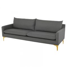 a gray couch with wooden legs and pillows on it's back end, against a white background