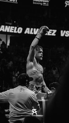 a black and white photo of a professional boxer