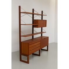 a wooden shelf with drawers and shelves on it