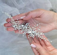 Our elegant Crystal Butterfly Wedding Hair Comb, a stunning accessory for your special day. This bridal hair comb is hand crafted with crystals, creating a glamorous and sophisticated look. Perfect for brides, bridesmaids, or any special occasion, this hair comb adds a touch of sparkle and style to your hairstyle. It effortlessly complements any wedding updo, enhancing your overall bridal look. ❤ Beautiful silver butterfly bridal hair comb for your special day!  ❤ Wedding hair comb is the perfect wedding hair accessory for the bride. ❤ This bridal hair piece is soft and flexible and can be worn at the front as a headband, back or side of your hair and can be shaped to suit any hairstyle. ❤ Handmade  ❤ Length of comb - 7 inches Butterfly Wedding Hair, Butterfly Hair Comb, Pearl Wedding Hair, Bridal Hair Combs Pearl, Wedding Bridal Hair, Bridal Hair Piece, Wedding Hair Comb, Butterfly Wedding, Crystal Butterfly