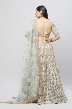 Entirely handcrafted with zardosi and crystal embroidery, this mint green lehenga is a stunner! Adorned with blush and blue resham kadhai to create a beautiful contrast! Fabric: Pure silk All preorders will be handled by a Nazranaa Bridal Consultant who will virtually discuss measurements and minor changes according to the client's specifications Occasion: Wedding Ceremony or Reception WASH CARE INSTRUCTIONS - Please Dry clean only when it is applicable. Slight color variation is possible due to Reception Lehenga In Pista Green With Sheer Dupatta, Pista Green Choli With Sheer Dupatta For Reception, Designer Pista Green Lehenga With Sheer Dupatta, Elegant Pista Green Choli With Dori Work, Pista Green Embroidered Dupatta For Reception, Pista Green Bollywood Embroidered Fabric For Reception, Pista Green Gown With Dori Work For Reception, Pista Green Lehenga With Resham Embroidery For Reception, Pista Green Anarkali Embroidered Fabric For Reception