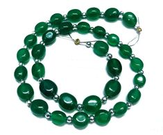 "=>Gemstone:- Green Onyx. =>shape:- Oval Shape. =>Size:- 5x6 to 7x8 mm. => Strand Length:- 8 inch.  ----------------------------------------------------------------------------------------------------- ###\"WE ARE MANUFACTURERS AND WHOLESALER''### => We assure you that you will like our products. our all items are made by our skilled workers in our factory. We make unique designs and fancy gemstones for our clients at reasonable prices. =>We take the pictures under professional studio lights and enlarge the items. The goal is to show the natural beauty of gemstones. Depending on your PC monitor screen, the colors of the stones may be slightly different than the pictures. ------------------------------------------------------------------------------------------------------ =>Important Note: Green Oval Gemstone Beads Jewelry, Green Onyx Gemstone Beads Necklace, Spiritual Green Onyx Gemstone Beads Jewelry, Spiritual Green Onyx Round Beads Jewelry, Luxury Green Onyx Round Beads Jewelry, Studio Lighting, Green Onyx, Jewelry Making Beads, Semi Precious Gemstones