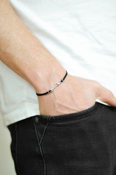 Arrow bracelet for men - cord bracelet with a silver arrow charm. The cords are  black and made of waxed cotton and the charm is silver plated. You can request a different cord color from the colors shown in the last picture.The bracelet is 7 1/2 inch long. If you would like a different length, you can choose your option at checkout.This bracelet is great as a gift for a man or a boy. All of our jewelry comes wrapped and ready for gift giving!*if you would like an adjustable sliding knot instead Jewelry Preppy, Arrow Bracelet, Pride Bracelet, Silver Arrow, Hamsa Bracelet, Silver Ring Designs, Hook Bracelet, Mens Bracelet Silver, Festival Jewelry