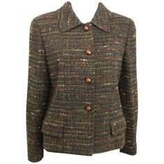 - Vintage Chanel brown multi colour (green, brown, black, etc...) cropped tweed jacket from 1998 A/W collection. Featuring four orange camellia flower buttons closure and on each cuff, two flap pocket. - Made in France. - Size 42. - Bust: 32 inches. Shoulder: 15 inches. Sleeve: 23 inches. Length: 22 inches. - 80% Wool, 20% Acrylic. 100% Silk Lining. Vintage Chanel Jacket, Chanel Tweed Jacket, Jackets Vintage, Tweed Jackets, Chanel Tweed, Chanel Jacket, Camellia Flower, Chanel Vintage, Brown Jacket