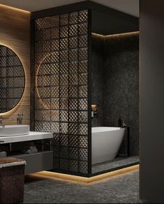 a bathroom with a tub, sink and round mirror in the wall next to it