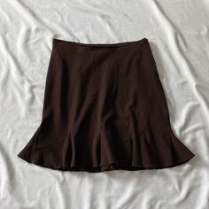 Vintage 2000s/1990s skirt in brown. Slightly stretchy. In good vintage condition. Note: I try to match colors as much as possible to pictures but there is a possibility it won't be an exact match. Unless the color is completely incorrect I am unable to offer refunds for this reason. Size: 3/4 Brand is Studio Y Measurements (taken on garment laid flat): Waist: 28" stretches comfortably to 30" Hips: 39" unstretched Length: 18" Fabric: 62% polyester, 35% rayon, 3% spandex Brown Stretch Mini Skirt, Brown Stretch Mini Length Bottoms, Stretch Brown Mini Length Bottoms, Fitted Brown Skirted Bottoms, Y2k Style Fitted Brown Skirt, Brown Lined Mini Pencil Skirt, Brown Fitted Y2k Skirt, Fitted Brown Pencil Skirt Casual Style, Casual Fitted Brown Pencil Skirt