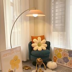 a blue chair sitting next to a lamp on top of a hard wood floor