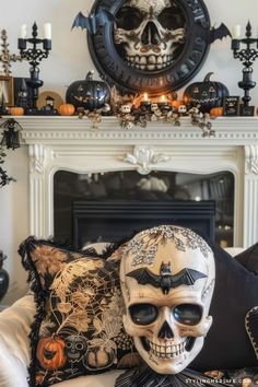 a living room decorated for halloween with skulls, candles and other decorations on the fireplace mantel