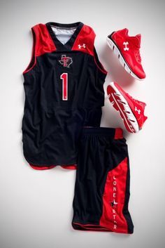 a basketball uniform and shoes are laid out on the floor