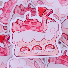 a pile of pink and white stickers with a bird on it's head