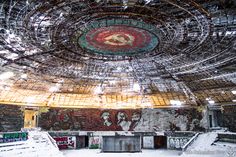 the inside of an abandoned building covered in graffiti