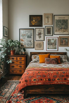 a bed sitting in a bedroom next to a window with lots of pictures on the wall