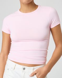 This jersey style t-shirt features supersoft material, short sleeves and a long line length. Trendy Solid Color Elastane T-shirt, Pink Short Sleeve Top In Elastane, Pink Short Sleeve Elastane Top, Fitted Pink Short Sleeve T-shirt, Spring Sporty Tops With Shirttail Hem, Sporty Spring Tops With Shirttail Hem, Trendy Fitted Elastane T-shirt, Sporty Everyday Tops Made Of Elastane, Sporty Everyday Tops