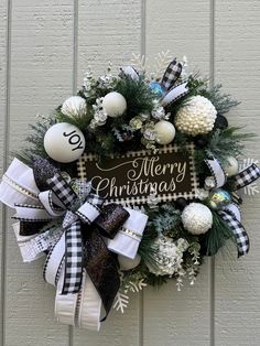 a christmas wreath hanging on the side of a building