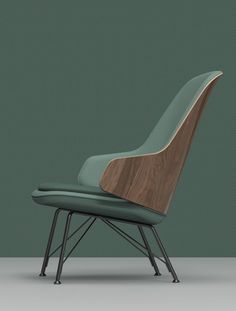 an upholstered chair with a wooden seat and backrest, in front of a green wall