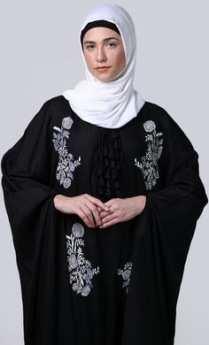 Essence Abaya is the simple, comfortable, easy and reliable breathable abayaA Proper Dress Is A Very Important Part Of Salah/Namaz. It Not Only Covers Us In A Proper Manner But It Also Relieves Us Of Consciousness Of Not Exposing The Awrah. The abaya Is Traditionally Worn Over Your Clothes For any occasion, Reading Of Quran Or Additional Modesty When In Groups. This Article Is Made Of Cotton Fabric Which Is Very Soft, Breathable, Light Weight And Easy To Maintain. It Gives A Good Fall To The Gar Black Tunic Abaya For Eid, Black Thobe With Floral Embroidery And Long Sleeves, Black Long Sleeve Thobe With Floral Embroidery, Kaftan Style, Patch Work, Embroidered Patch, Embroidered Patches, Consciousness, New Black