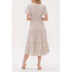 Introducing our August Sky Women's Round Split Neckline Printed Tiered Midi Dress, a delightful addition to your wardrobe. Featuring a split v-neckline and short flounce sleeves, it exudes feminine charm. The elastic waistline ensures a flattering fit, while the all-over geometric print adds a stylish touch. The tiered skirt enhances its playful elegance, and the dress is fully lined for comfort. Crafted from non-stretch fabric, this midi dress is perfect for any occasion, from casual outings to Beige Midi Dress With Surplice Neckline For Spring, Beige Surplice Neckline Midi Dress For Spring, Feminine V-neck Midi Dress For Day Out, Summer Beige Midi Dress With Surplice Neckline, Casual White Midi Dress With Surplice Neckline, Beige Midi Dress With Surplice Neckline For Summer, White Casual Midi Dress With Surplice Neckline, Spring Midi-length Swiss Dot Maxi Dress, Beige Mid-length Floral Print Dress