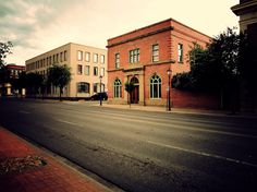 an empty street in front of some buildings