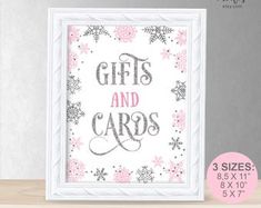 a pink and white christmas card with the words gifts and cards in silver foil on it