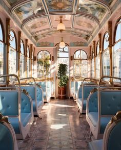 the inside of a train car with blue seats and gold trimmings on it