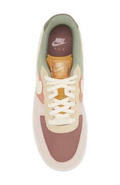 The basketball shoe that started a sensation keeps shooting and scoring as a street sneaker sporting layers of plush suede and colorblocked canvas. The iconic Air Force 1 sole features embedded Nike Air cushioning and crenellations along the tread that frame a star-studded bumper toe. Lace-up style Removable insole Leather, synthetic and textile upper/textile lining/rubber sole Imported Nordstrom x Nike: A curated lifestyle destination where fashion is the ultimate sport Sporty Cream Nike Air Force 1 For Casual Wear, Retro Beige Sneakers For Streetwear, Cream Nike Air Force 1 Sporty With Branded Insole, Nike Canvas Sneakers With Gum Sole, Sporty Beige Nike Air Force 1, Beige Canvas Sneakers For Sports, Cream Nike Air Force 1 Sporty Sneakers, Sporty Nike Air Force 1 In Cream, Sporty Beige Canvas Sneakers