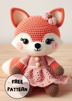 a crocheted fox doll sitting on top of a wooden table with the caption free pattern