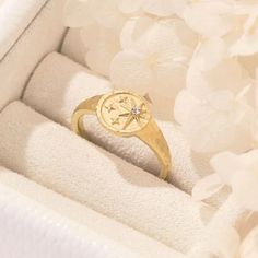 Introducing our stunning Gold Layering Signet Ring ✨, a captivating piece that embodies timeless elegance and modern style. With its intricate Starburst design ⭐, this Dainty Signet Ring brings a touch of celestial charm to your everyday look. Crafted with meticulous attention to detail, this Statement Ring is a true work of art. 🌟Gold Layering, Starburst Design, Dainty, Statement Ring, Gold Plated, Minimalist Signet Ring. 🌟 Luxurious and eye-catching, this Gold Plated Ring effortlessly captur Gift Signet Ring With Compass Design, Compass Design Ring Jewelry For Gift, Compass Design Jewelry Ring Gift, Engraved Celestial Promise Ring Jewelry, Compass Design Ring As A Gift, Symbolic Rings With Compass Design As Gift, Symbolic Rings With Compass Design For Gift, Symbolic Compass Design Ring As Gift, Celestial Tarnish-resistant Rings For Anniversary