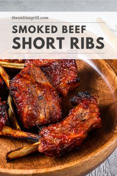 smoked beef short ribs on a wooden plate with text overlay that reads smoked beef short ribs