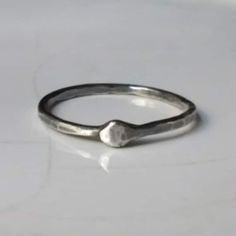 "Ouroboros ring, sterling silver ring, stacking ring, thumb or pinkie ring, gender neutral, KREIS collection. \"Ouroboros\" ring, KREIS 2016 collection. A single length of blackened and scarred 14 gauge in sterling silver, a snake devouring it's tail. Gender neutral stacking ring for finger, thumb or knuckle. Choose your size and material from the drop menu opposite or request a custom size. Gold Ouroboros rings are available here... https://www.etsy.com/listing/638074653/gold-ouroboros-ring-solid-gold-infinity Now also available in brass Leider muss ich aufgrund der Anzahl der Ringe, die zurückgeschickt/umgetauscht werden, nachdem die falschen Größen bestellt wurden, die kostenlose Anpassung/Umtausch einschränken. Unterschiede von mehr als 1 US-Größe kann nun eine Gebühr anfallen, so stel Silver Stackable Midi Rings For Promise, Handmade Stackable Toe Rings For Everyday, Handmade Everyday Stackable Toe Rings, Dainty Handmade Silver Stackable Rings, Dainty Hand Forged Sterling Silver Stackable Rings, Simple Sterling Silver Stackable Promise Rings, Simple Sterling Silver Promise Stackable Rings, Nickel-free Silver Minimalist Stackable Rings, Simple Silver Stackable Promise Rings