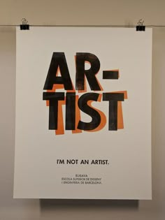 a poster hanging on the wall that says art - test i'm not an artist