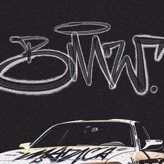 a car parked in front of a black wall with graffiti on it