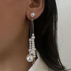 This Pearl Gold Color Faux Pearl Dangle Tassel Earrings Is A Wonderful Addition To Your Wardrobe And Your Style! A Fun And Unique Pair Perfect For Any Occasion With Any Outfit. Great For Weddings, Sweet Sixteen, And Quinceaneras. Elegant White Tassel Earrings For Pierced Ears, White Dangle Tassel Earrings For Party, White Tassel Earrings For Pierced Ears Party, White Tassel Earrings For Party, White Tassel Dangle Earrings, Pearl White Dangle Chandelier Earrings For Party, White Chic Dangle Chandelier Earrings, White Pearl Dangling Beads Earrings For Party, White Dangling Beads Pearl Earrings For Party