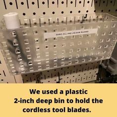 there is a sign that says we used a plastic 2 - inch deep bin to hold the cordless tool blades