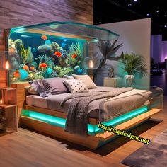 a bed with an aquarium in the middle of it and lights on either side of it