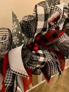 a red, white and black christmas wreath