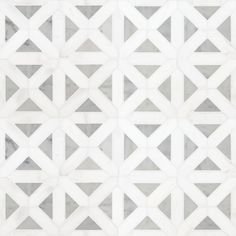 a white and grey tile pattern that looks like hexagonals