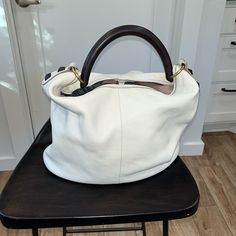 White Leather Shoulder Bag With Hard Carry Handle By J.Crew. Nwt. Approx 12” High And 14” Wide. Clip/Buckle At The Top Of The Bag To Hold It Closed. A Couple Of Small Marks On The Bottom From Storing The Bag In My Closet. White Hobo Bag With Double Handle, White Bucket Bag With Double Leather Handles, White Hobo Shoulder Bag With Handles, White Bucket Satchel For Everyday Use, White Bucket Satchel, White Everyday Bag With Handle Drop, White Double Handle Hobo Bag For Errands, Everyday White Bucket Satchel, White Double Handle Hobo Bag