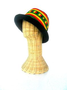 This Rasta Jamaican Bucket hat is perfect for Summer Reggae Festivals. This solid Bucket hat features a Jamaican Rasta Inspired Striped Band atop a solid , Red green yellow Rasta color bucket hat. Rock this hat as you dance the night away at your next outdoor concert or event. Fashionable and a must-have . This Hat is unisex that looks great on both men and women . This Hat is very durable and can be used as a special gift . -Solid Unisex Jamaican Adult Bucket Sun Hat -Rasta Reggae Inspired Stri Beach Felt Cap, Casual Short Brim Felt Hat For Festivals, Retro Bucket Hat With Curved Brim For Festivals, Retro Adjustable Sun Hat For Festivals, Adjustable Retro Sun Hat For Festivals, Retro Festival Bucket Hat With Curved Brim, Retro Curved Brim Bucket Hat For Festivals, Adjustable Brimmed Bohemian Cloche Hat, Retro Wide Brim Adjustable Costume Hat