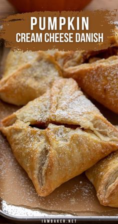 Close-up image of a tray filled with square shaped pumpkin cream cheese danishes dusted with powdered sugar. Pumpkin And Cream Cheese, Pumpkin Cream Cheese, Cheese Baked, Pumpkin Cream Cheeses, Pumpkin Recipes Dessert, Spiced Pumpkin